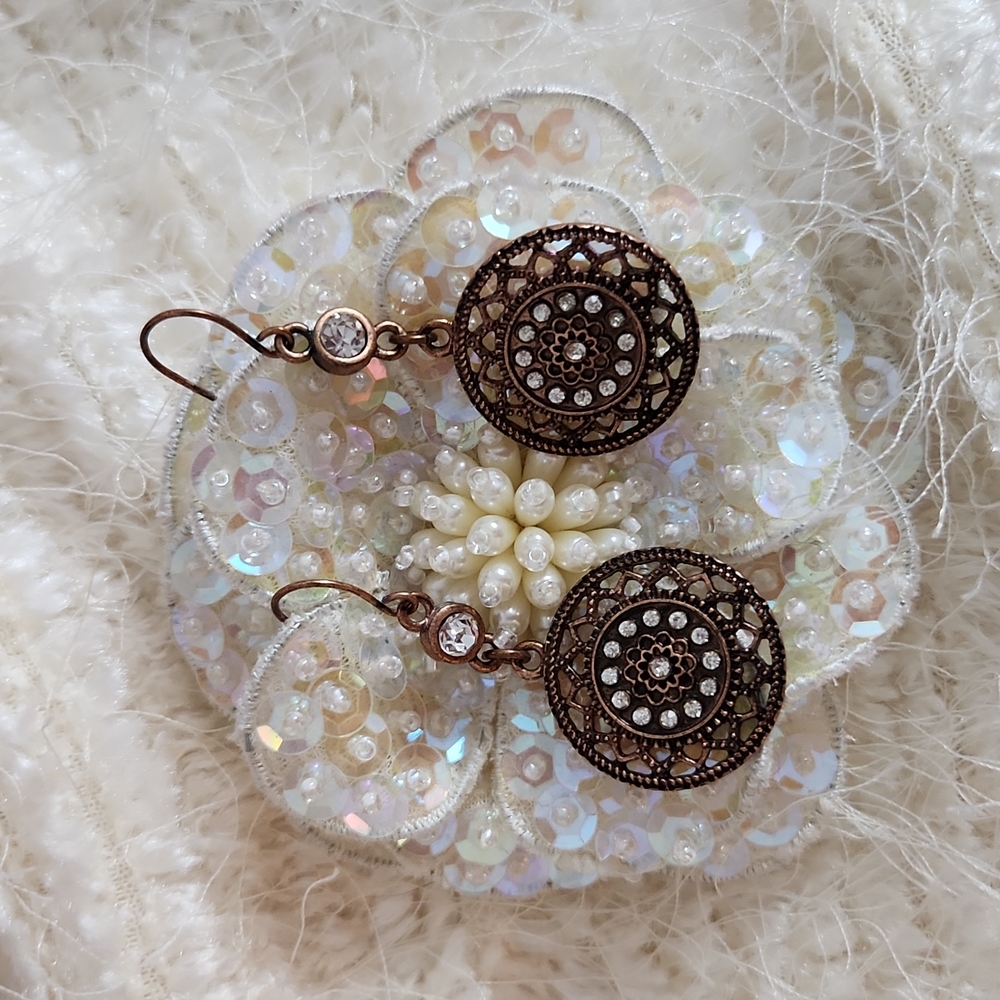 Copper color earrings with clear stones